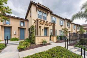Chula Vista apartment for rent - A row of houses with blue doors and windows.