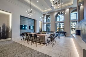 Spring apartment for rent - A modern dining room with a large table and chairs.