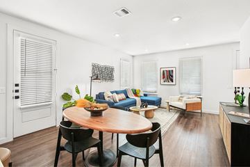 San Antonio apartment for rent - A modern living room with a dining table and chairs.