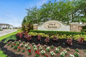 Port St Lucie townhouse for rent - the sign for villas at the entrance to thevillage sign