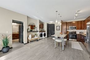Huntsville apartment for rent - A modern kitchen with a dining table and chairs.