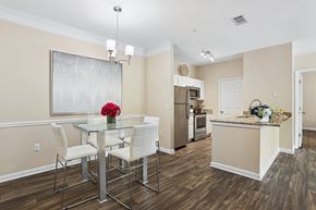 Atlanta apartment for rent - A dining room with a glass table and chairs.