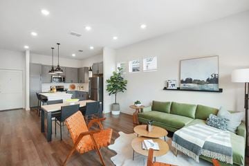 San Antonio apartment for rent - a living room with a couch and a table and a kitchen