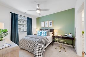 Acworth apartment for rent - a bedroom with a bed and a desk and a window
