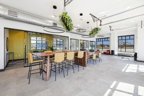 Huntsville apartment for rent - A modern dining room with a long table and chairs.