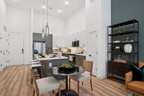 Dallas apartment for rent - A modern kitchen with a dining table and chairs.