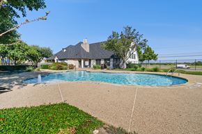 Fort Worth apartment for rent - A house with a pool in the backyard.