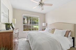 San Antonio apartment for rent - A bedroom with a large bed and a ceiling fan.