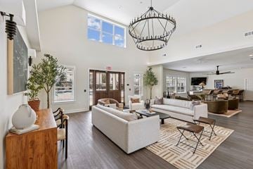 Jackson apartment for rent - A spacious living room with a large sofa set and a chandelier.