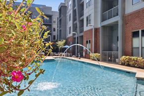 Nashville apartment for rent - A pool with a fountain in the middle of it.