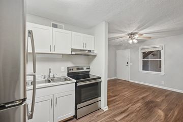 Nashville apartment for rent - A kitchen with white cabinets and stainless steel appliances.
