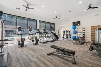 24-Hour fitness center including cardio theatre, free weights and rock climbing wall