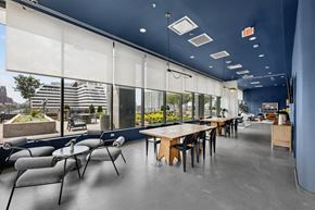 Nashville apartment for rent - A modern dining area with a long table and chairs.