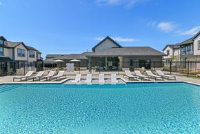 Grand Prairie apartment for rent - Community pool with tanning lounge chairs in Grand Prairie