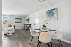 Largo apartment for rent - a dining room with a table and chairs and a living room