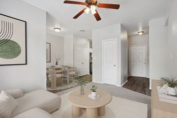 Arlington apartment for rent - A living room with a white couch and a brown coffee table.