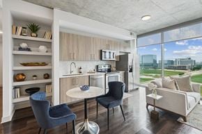 Frisco apartment for rent - A modern kitchen with a dining table and chairs.