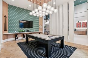 Frisco apartment for rent - A room with a pool table and a television.