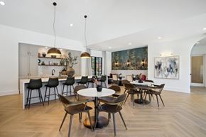 Hoschton apartment for rent - a dining room with tables and chairs and a kitchen