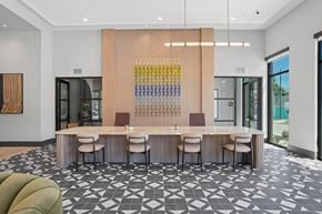 Dallas apartment for rent - A modern dining room with a long table and chairs.