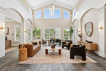 Atlanta apartment for rent - A spacious living room with a brown sofa set and a coffee table.