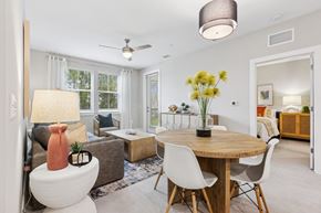 Palm Bay apartment for rent - A well-lit, modern dining room with a round table and chairs.