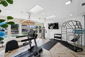 Arlington apartment for rent - A gym with treadmills, weights, and exercise equipment.