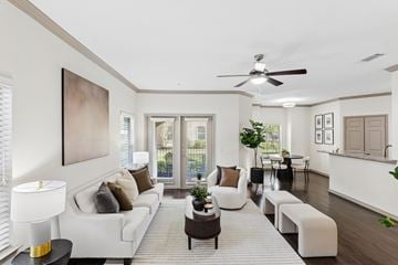 Conroe apartment for rent - A living room with a white couch and a painting on the wall.