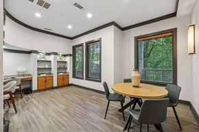 Atlanta apartment for rent - A dining room with a round table and chairs.