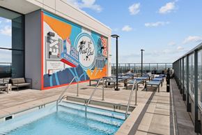 Nashville apartment for rent - A pool with a mural on the wall next to it.