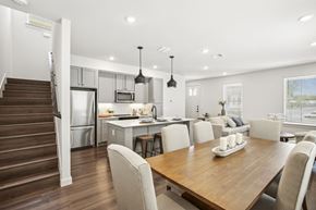 San Antonio apartment for rent - a living room and kitchen with a wooden table and chairs