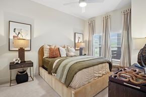Sherman apartment for rent - A bedroom with a large bed and a painting on the wall.