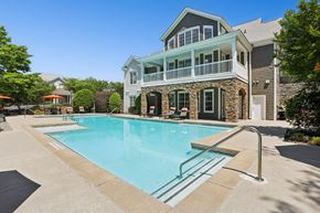 Atlanta apartment for rent - A large house with a pool in front.