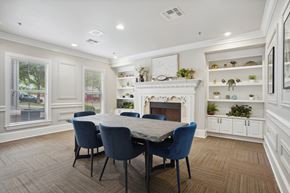 Arlington apartment for rent - a dining room with a table and chairs in front of a fireplace