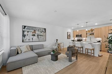 Davenport apartment for rent - A modern living room with a grey sofa and a coffee table.