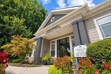 Atlanta apartment for rent - The Seven Springs Marketing Center is a building with a sign in front of it.