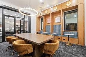 Plano apartment for rent - A conference room with a long table and chairs.
