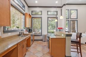 Atlanta apartment for rent - A kitchen with wooden cabinets and a countertop.