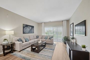 Brighton apartment for rent - A living room with a couch, a coffee table, and a painting on the wall.