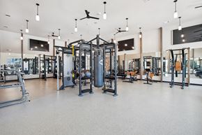 San Antonio apartment for rent - a gym with weights and other exercise equipment in a large room