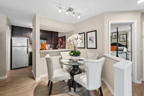 Winston Salem apartment for rent - A modern kitchen with a dining table and chairs.