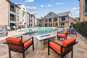 San Antonio apartment for rent - A pool area with a hot tub and chairs.