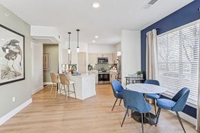 The Colony apartment for rent - A modern kitchen with a dining table and chairs.