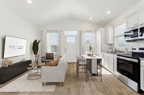 Gainesville apartment for rent - A modern kitchen with a dining table and chairs.