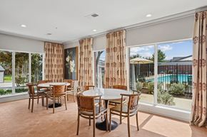 Mckinney apartment for rent - A dining room with a table and chairs at Towns at Chapel Hill in Plano Texas