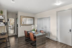 Aurora apartment for rent - A dining room with a wooden table and chairs.