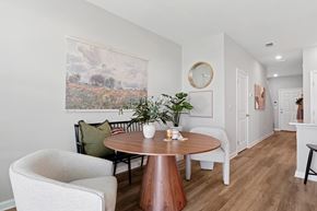 Jacksonville apartment for rent - A dining room with a round table and chairs.