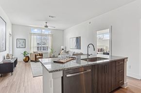 Atlanta apartment for rent - A modern kitchen with a large island and stainless steel appliances.