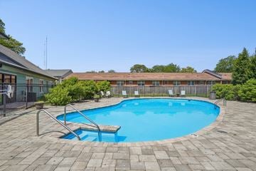 Indianapolis apartment for rent - A small pool surrounded by a brick patio.