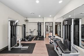 Lafayette apartment for rent - A gym with a variety of equipment including treadmills, weights, and exercise machines.